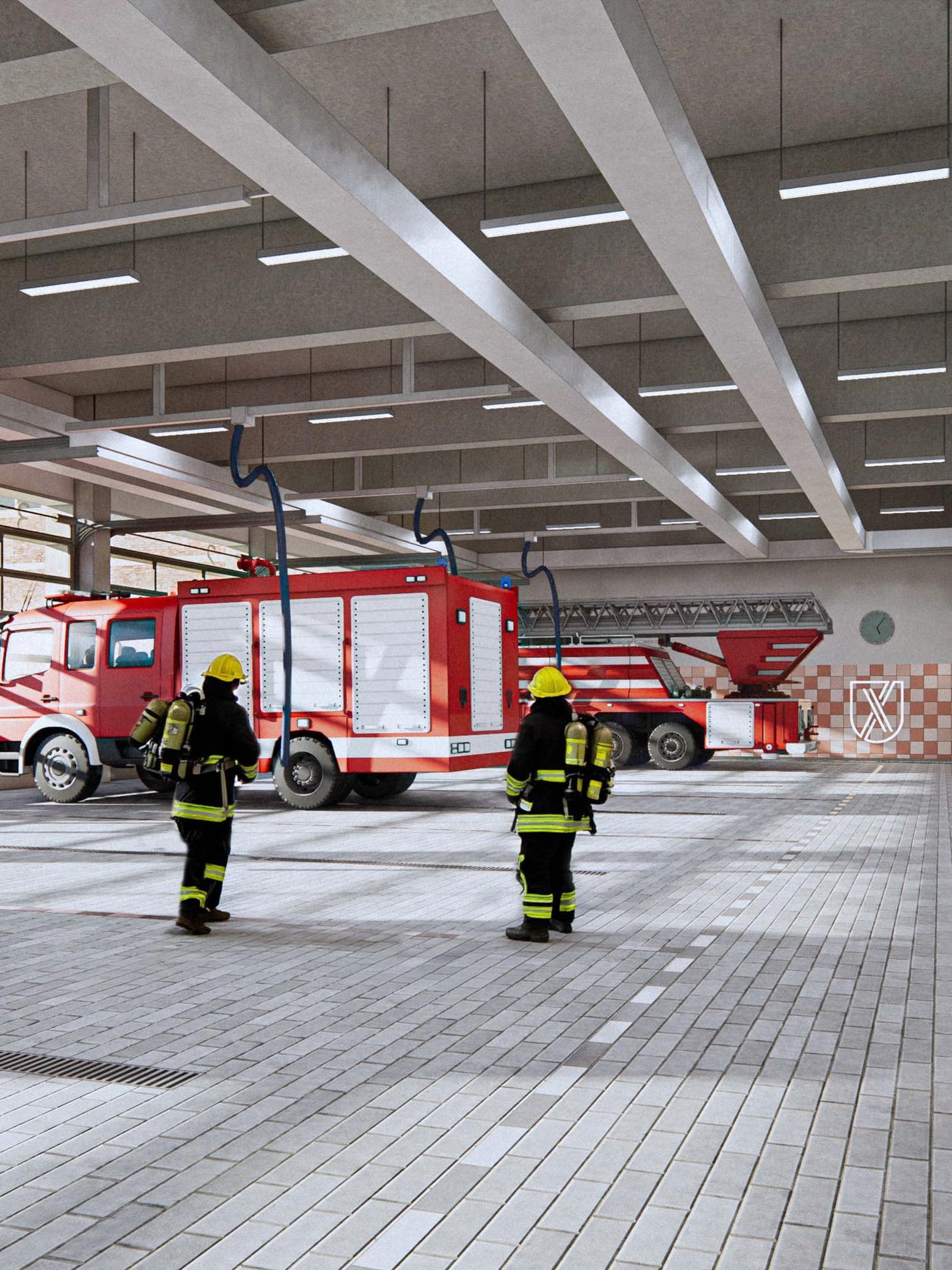 Fahrzeughalle der neuen Feuer- und Rettungswache mit Fliesen und Feuerwehrautos